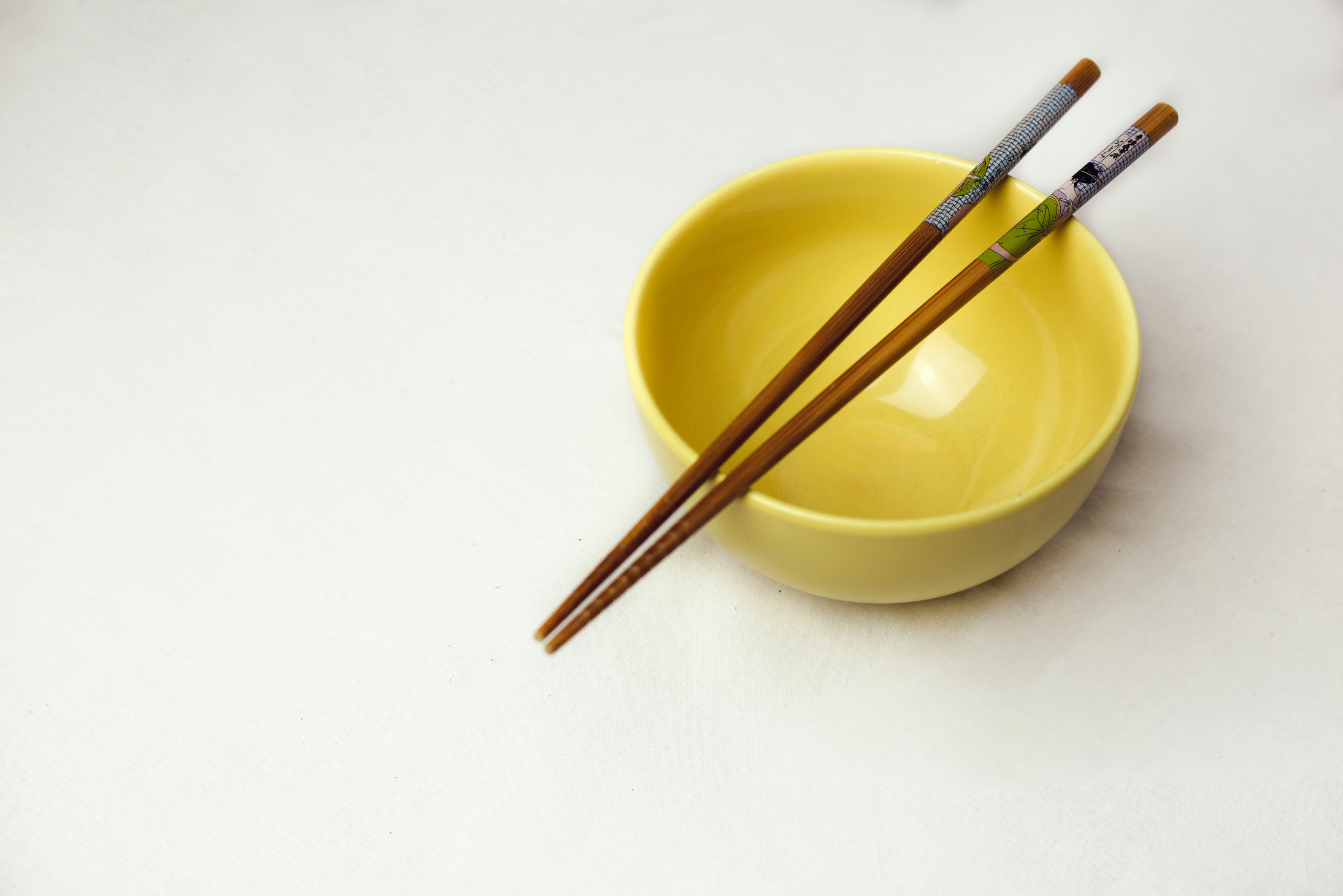 Wooden Chopsticks on Ceramic Bowl 